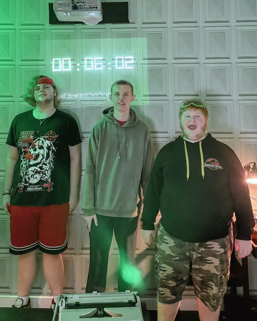 Young people at an escape room with EDS support workers
