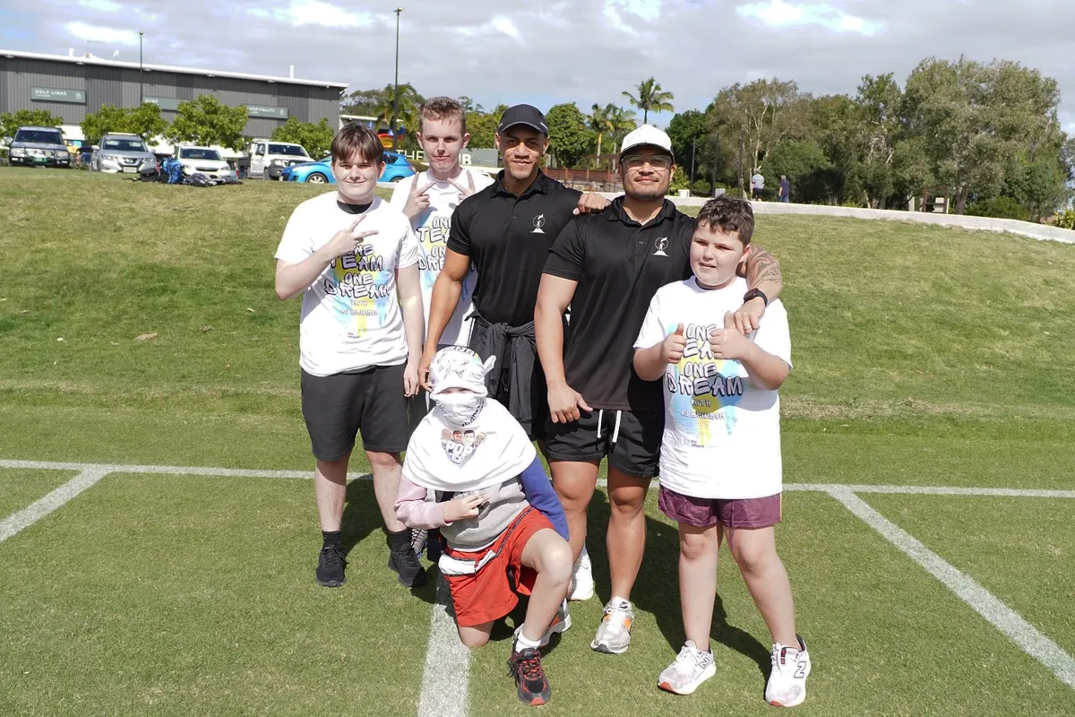 Young people and EDS staff at a field day