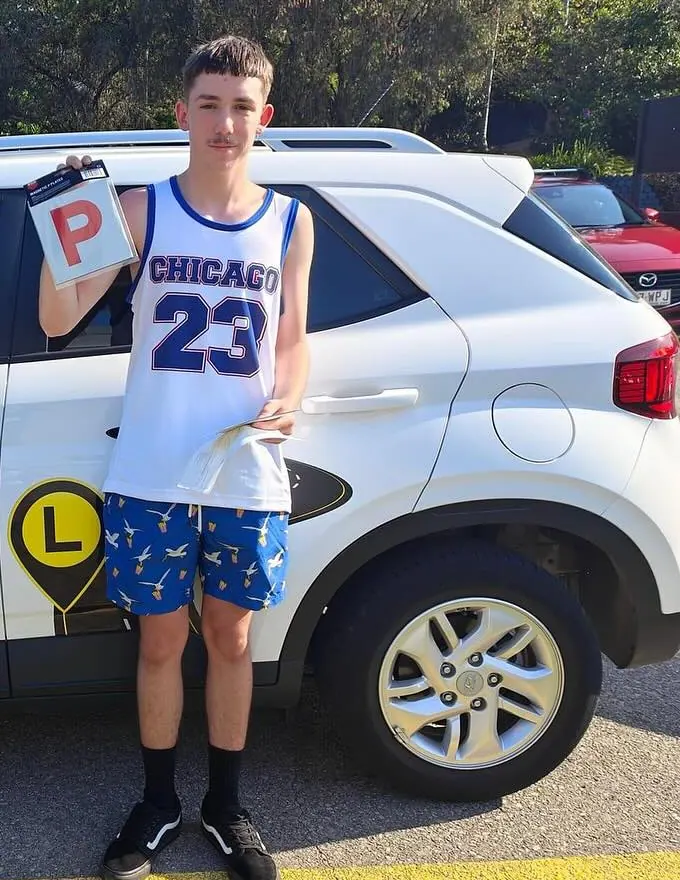 Young person celebrating getting their P plates